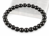 Natural Black Obsidian bead bracelet angled display on selenite plate