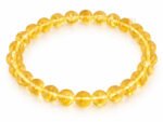 Citrine bracelet with natural yellow round beads 8mm on white background
