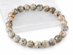 Grey Jasper gemstone bracelet displayed on selenite plate