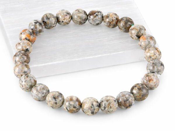 Grey Jasper gemstone bracelet displayed on selenite plate