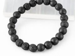 Lava Quartz diffuser bracelet angled display on selenite plate