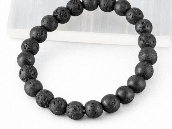 Lava Quartz diffuser bracelet angled display on selenite plate