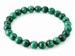 Natural Malachite 8mm round bead bracelet on a white background.