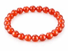 Natural Red Quartz 8mm round bead bracelet isolated on a plain white background.