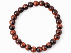 Natural Red Tiger Eye 8mm round bead bracelet isolated on a plain white background.