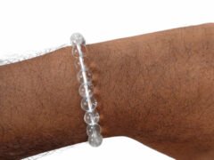Natural Rock Crystal Sphatik gemstone bracelet being worn on a wrist to show scale and fit.