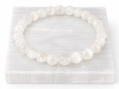 Authentic natural Selenite gemstone bracelet resting flat on a white square display plate.