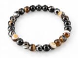Natural Sulemani Hakik Black Agate 8mm round bead bracelet isolated on a plain white background.