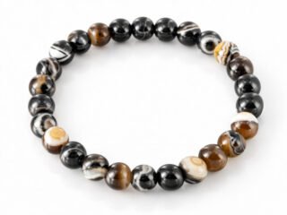 Natural Sulemani Hakik Black Agate 8mm round bead bracelet isolated on a plain white background.