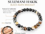 Infographic highlighting the natural Sulemani Hakik Black Agate 8mm bracelet features, including natural authentic bands of black, white, brown, and grey, and premium quality.