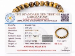 Official gem testing laboratory certificate for the natural Tiger Eye bracelet, displaying a weight of 98 carats and 8mm dimension.