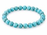 Turquoise Firoza 8mm round bead bracelet isolated on a plain white background.