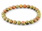Natural Unakite 8mm round bead bracelet isolated on a plain white background.