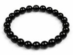 Natural Black Quartz 8mm round bead bracelet isolated on a plain white background.