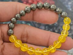 Citrine and pyrite bracelet shown on hand closeup