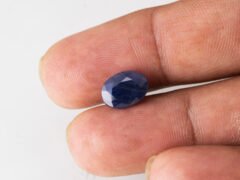 Neelam loose gemstone 4.64 carat in hand size reference