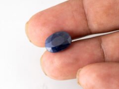 Neelam loose gemstone 6.01 carat in hand size reference