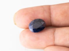 Neelam loose gemstone 9.99 carat in hand size reference