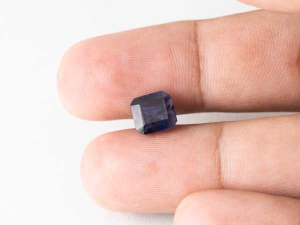 Bangkok blue sapphire neelam 2.85 carat in hand size reference