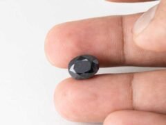 Bangkok blue sapphire neelam 6.95 carat in hand size reference