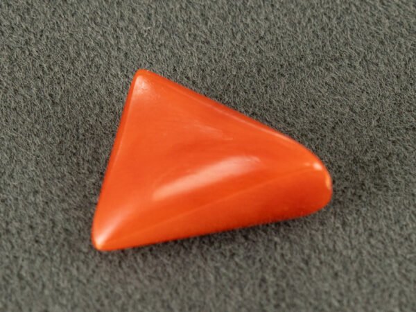 italian red coral moonga 4.31 carat side view triangle cabochon gemstone