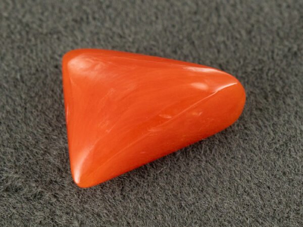 italian red coral moonga 4.32 carat side profile triangle cabochon