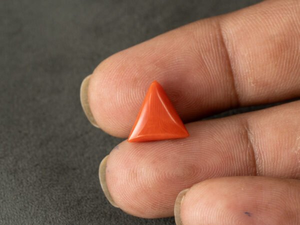 italian red coral moonga 4.33 carat in hand size reference