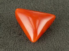 italian red coral moonga 4.34 carat side profile triangle cabochon