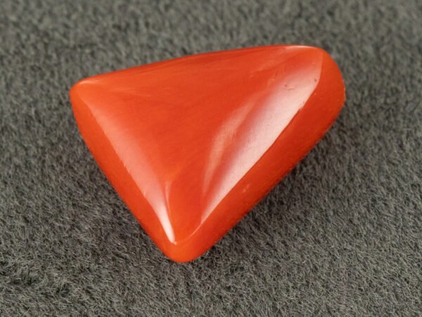 italian red coral moonga 4.36 carat side profile triangle cabochon