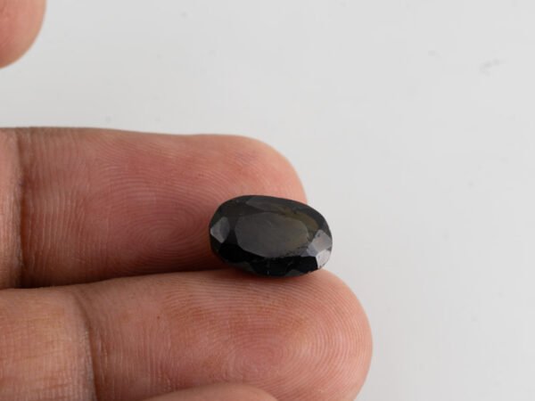 natural black tourmaline 4.83 carat in hand size reference