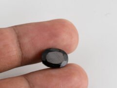 natural black tourmaline 5 carat in hand size reference