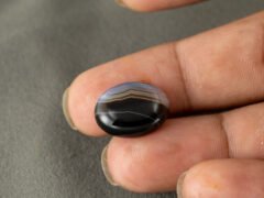 Sulemani Hakik 10.79 Carat in-hand size reference 18.4 x 14.2 mm