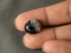 Sulemani Hakik 12.45 Carat in-hand size reference 17.1 x 13.5 mm