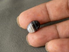 Sulemani Hakik 5.48 Carat in-hand size reference 13.8 x 9.8 mm