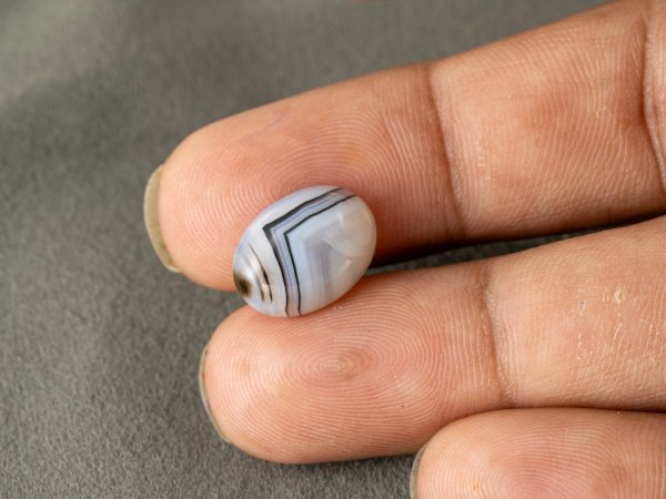 Sulemani Hakik 6.63 Carat in-hand size reference 15 x 11.2 mm