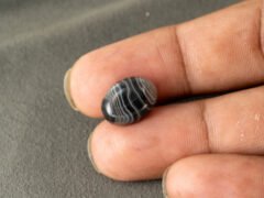 Sulemani Hakik 6.81 Carat in-hand size reference 14.4 x 10.9 mm