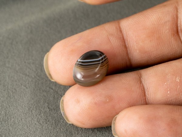 Sulemani Hakik 7.41 Carat in-hand size reference 15 x 11.5 mm