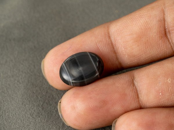 Sulemani Hakik 7.92 Carat in-hand size reference 17 x 13 mm