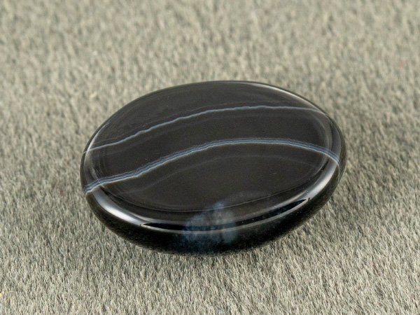 Sulemani Hakik 8.66 Carat in-hand size reference 16.3 x 12.3 mm