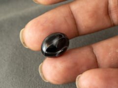 Sulemani Hakik 9.24 Carat in-hand size reference 16.7 x 12.4 mm