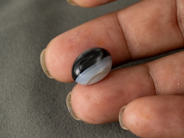 Sulemani Hakik 9.34 Carat in-hand size reference 15.8 x 12 mm