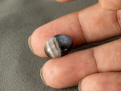 Sulemani Hakik 9.61 Carat in-hand size reference 16 x 12.3 mm