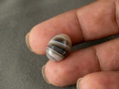 Sulemani Hakik 9.68 Carat in-hand size reference 16.4 x 12.5 mm