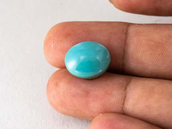 American firoza 11.10 carat turquoise in hand size reference