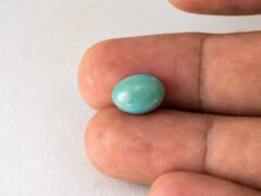 American firoza 5 carat turquoise in hand size reference