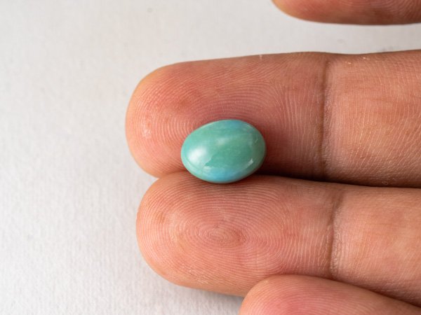 American firoza 5 carat turquoise in hand size reference