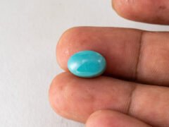American firoza 6.44 carat turquoise in hand size reference