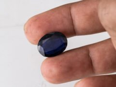 Natural Kaka Neeli Stone Iolite 11.31 carat in hand size reference