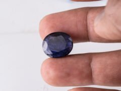 Natural Kaka Neeli Stone Iolite 11.38 carat in hand size reference