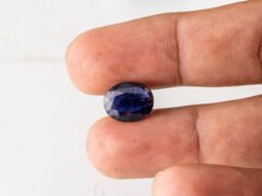 Natural Kaka Neeli Stone Iolite 4.29 carat in hand size reference